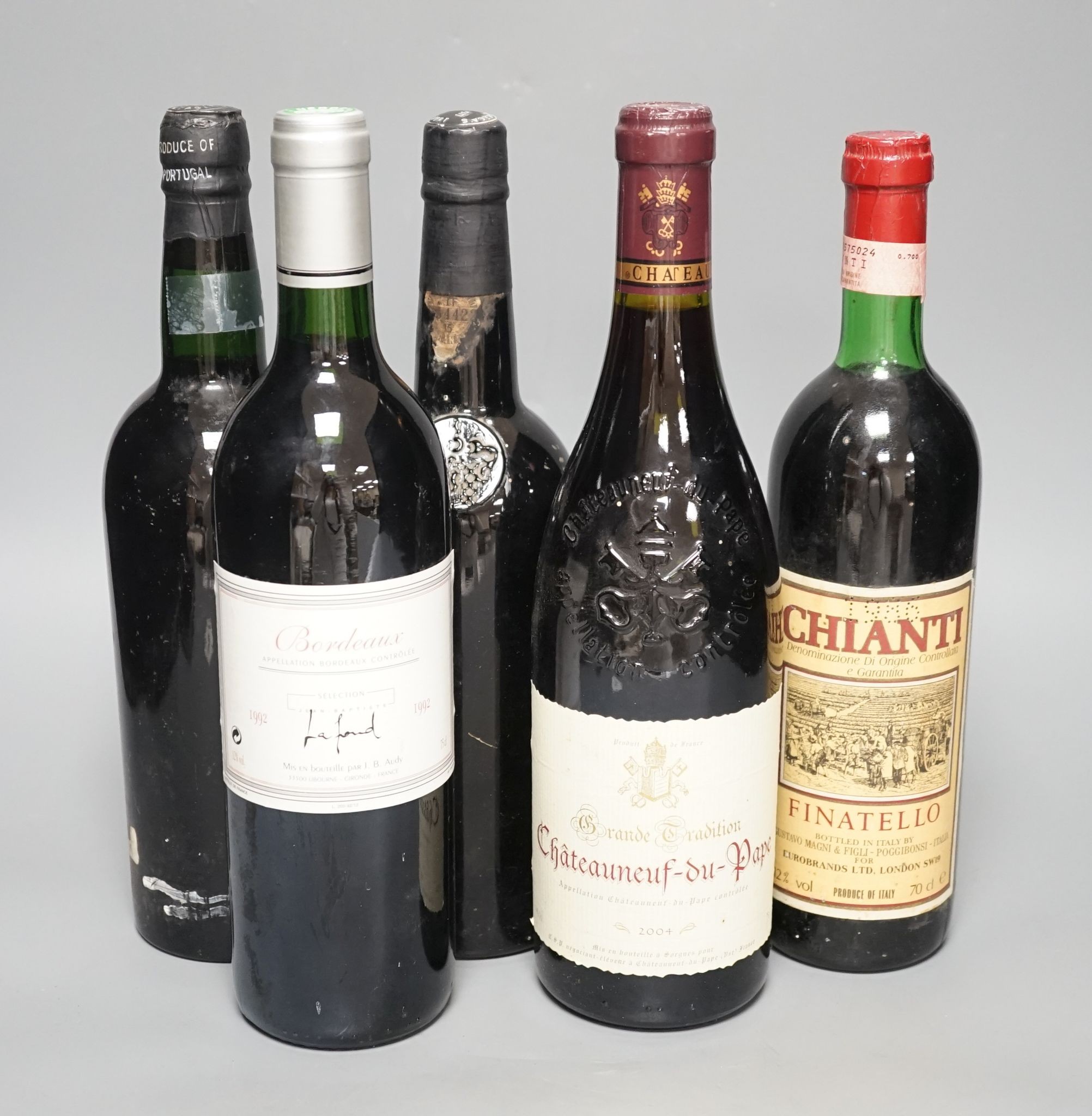 A bottle of Warres 1963 Vintage Port, a bottle of Fonsecca, 1977 Vintage Port and three bottles of wine